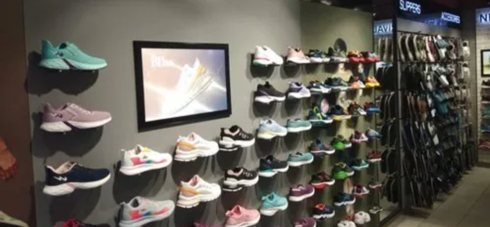 Flat lay of the latest sneaker collection from The Shoe Store, featuring pastel tones and minimalist designs."